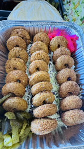 A beautiful Middle Eastern catering platter from Les Saj, filled with chicken shawarma, rice, and fresh salads for an event in Winnipeg.