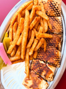 A delicious shawarma wrap being prepared at a Les Saj location.